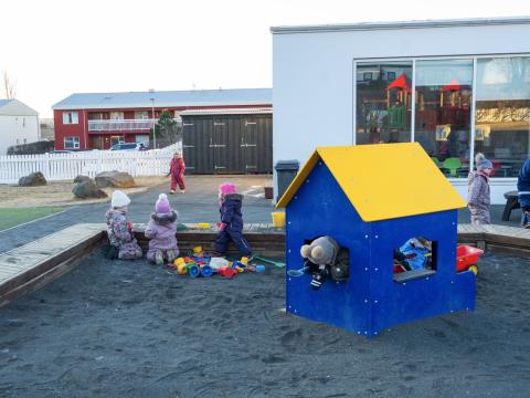Photo of children playing on a preschool playground.