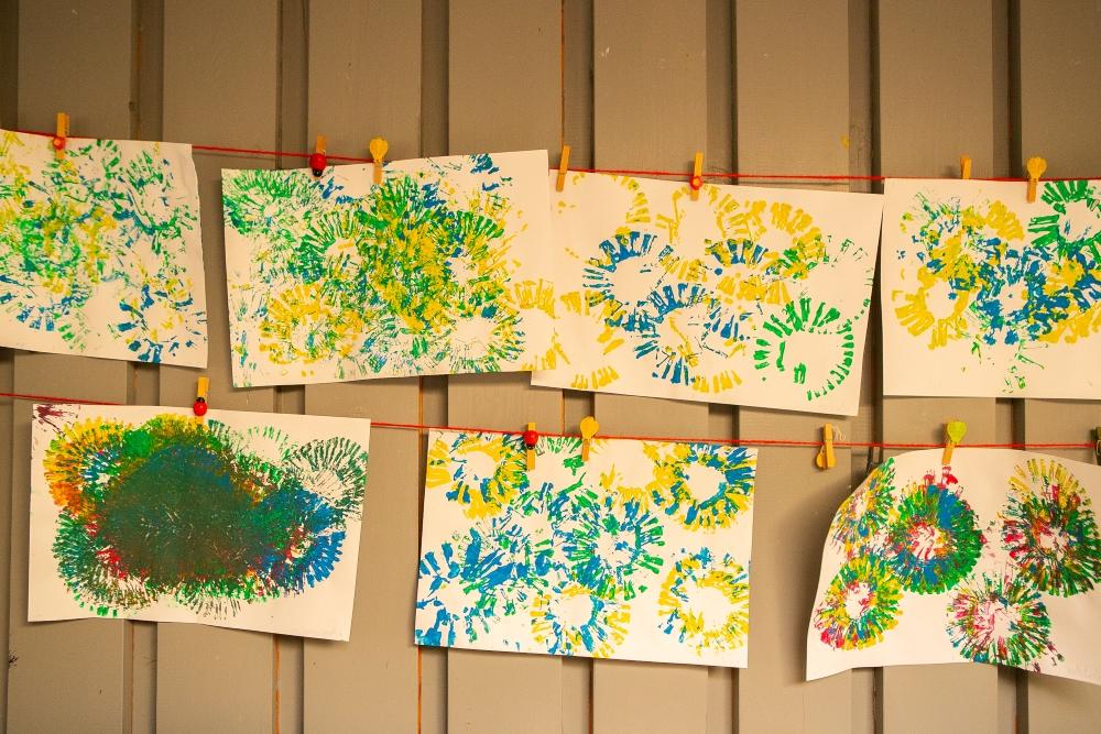 Artwork by children on the wall inside at Drafnarsteinn.