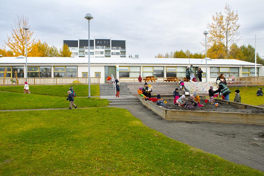 Children and playground equipment on the grounds of Hálsaskógur.