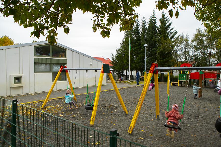Children playing on the grounds of Hálsaskógur.