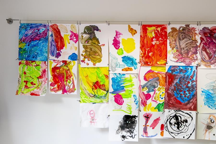 Artwork by children hangs on the wall inside Jörfi.