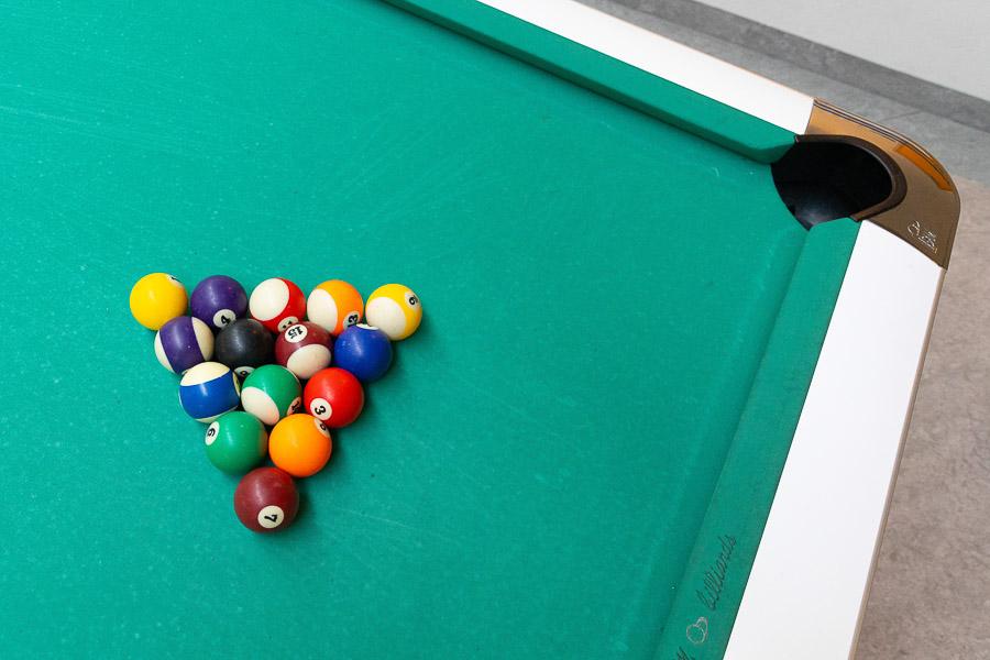 Pool balls on a pool table. 