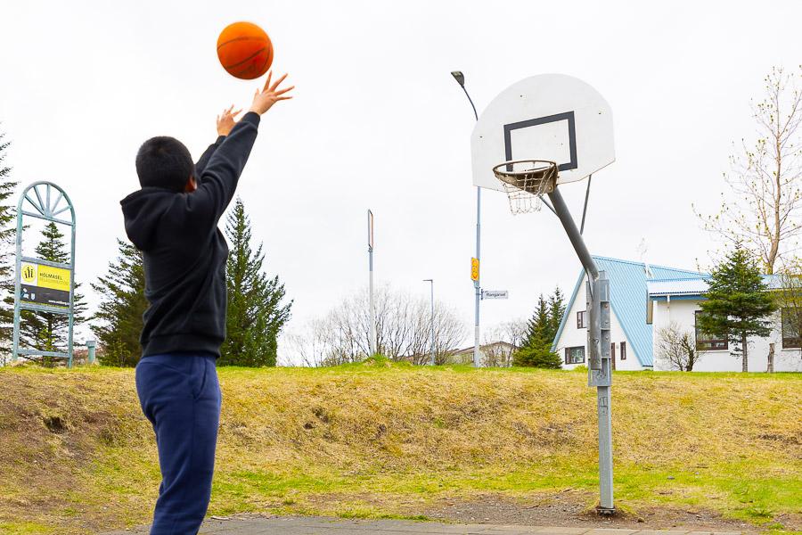 Young people playing basketball. 