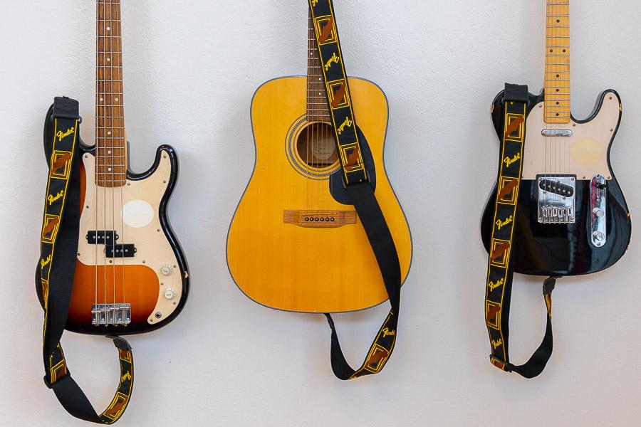 Guitars mounted on the wall. 