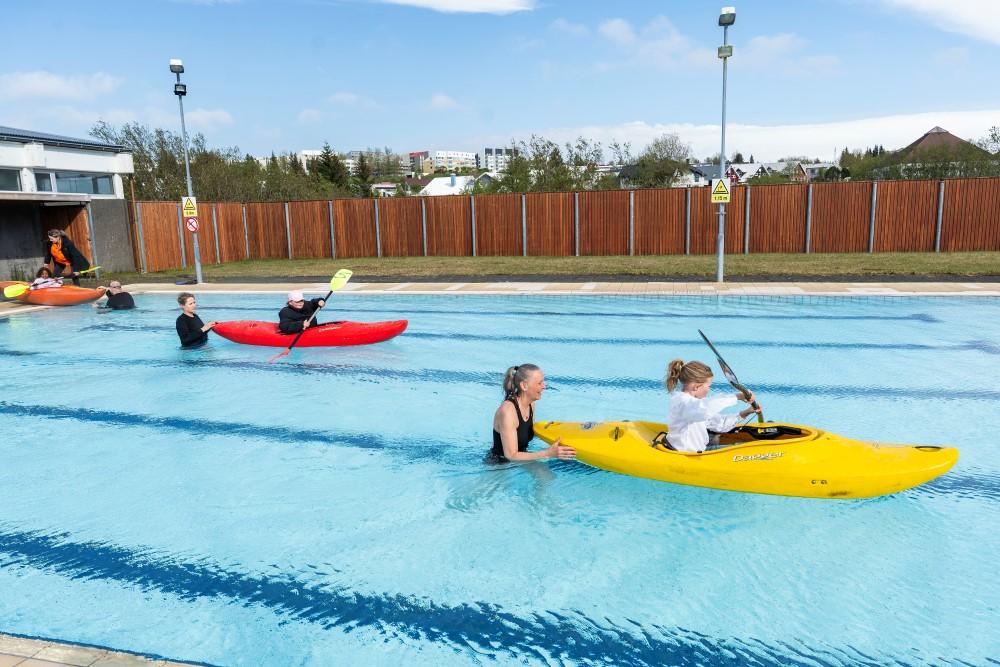Kayaking in the swimming pool.