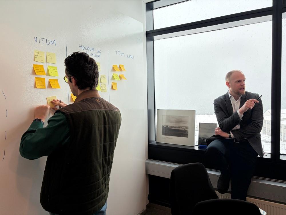 Post-it notes with ideas hung on the wall.