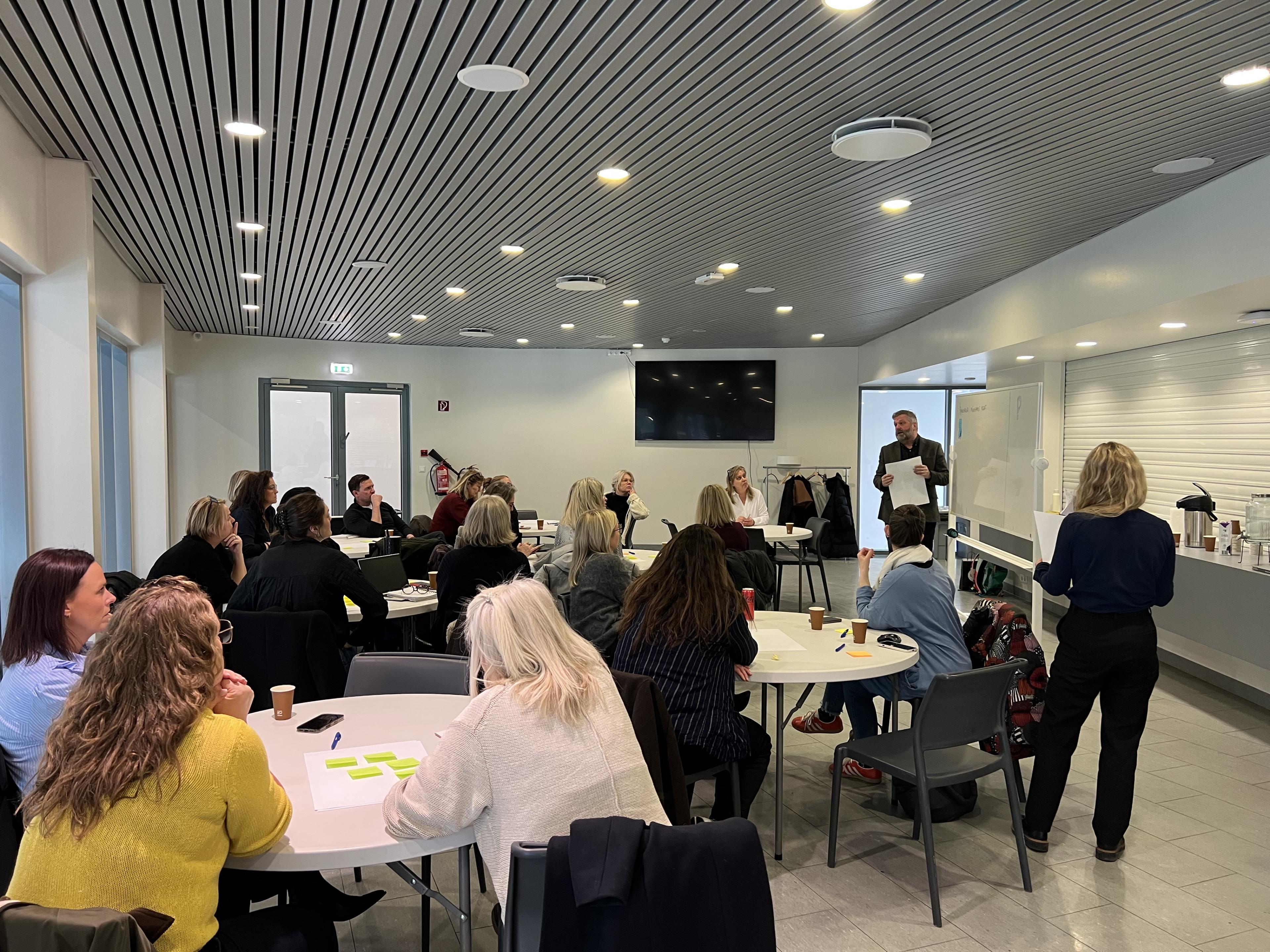 Photo of experts in discussion at a workshop