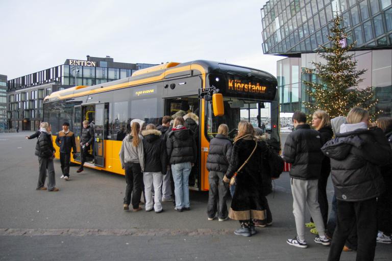 Young people line up at a bus outside Harpa. It was set up as a polling station for the Youth Democracy Festival.