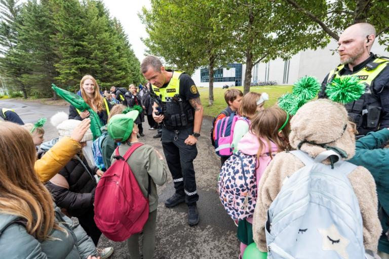 Police chatting with children.