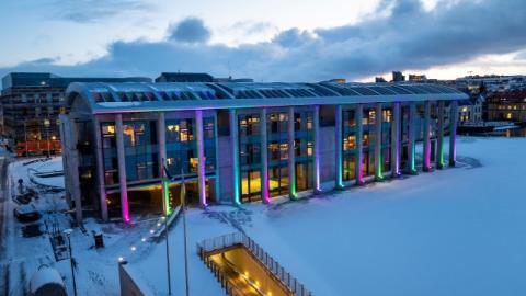 City Hall lit up in the organization's colors for Rare Disease Day