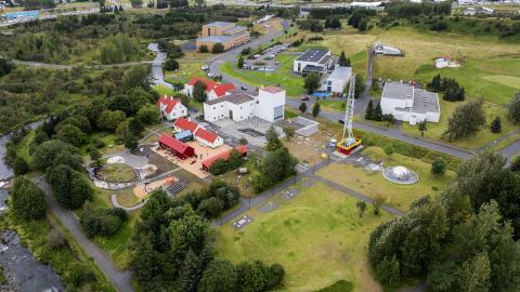 Aerial view of Elliðaárdalur. The Elliðaár power station, Hitt Húsið Youth Center, and other buildings appear in the center of the image. 